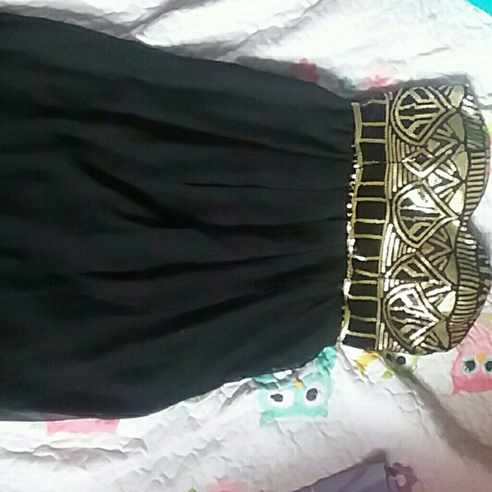 Knee high, black and gold sequin dress